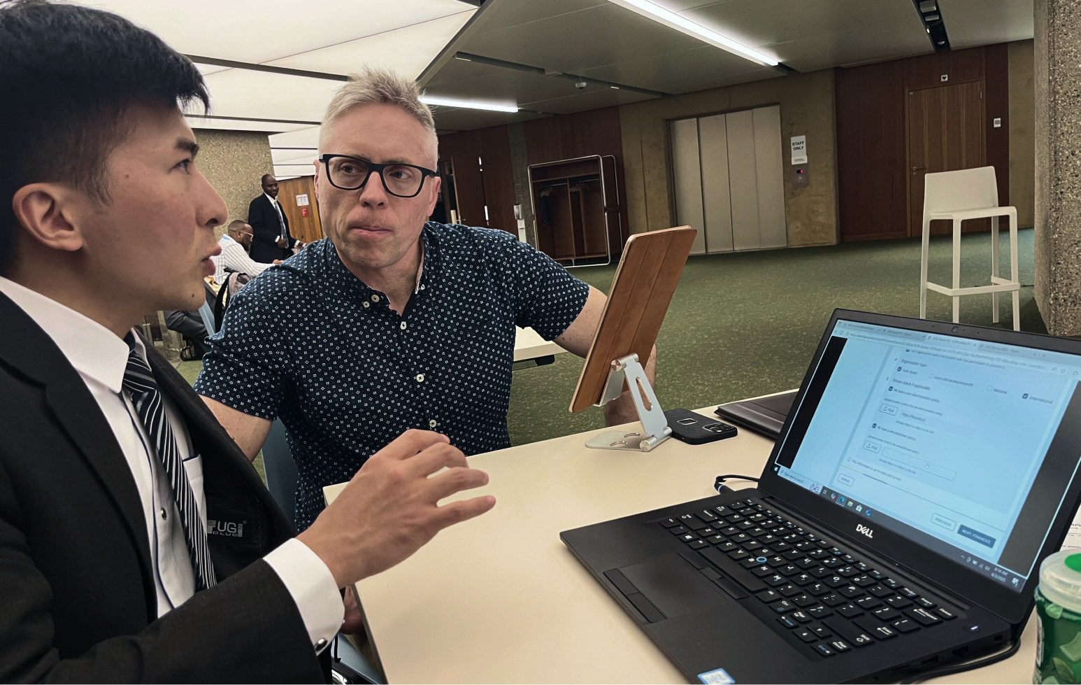 Facilitating a usability interview while taking notes at the conference